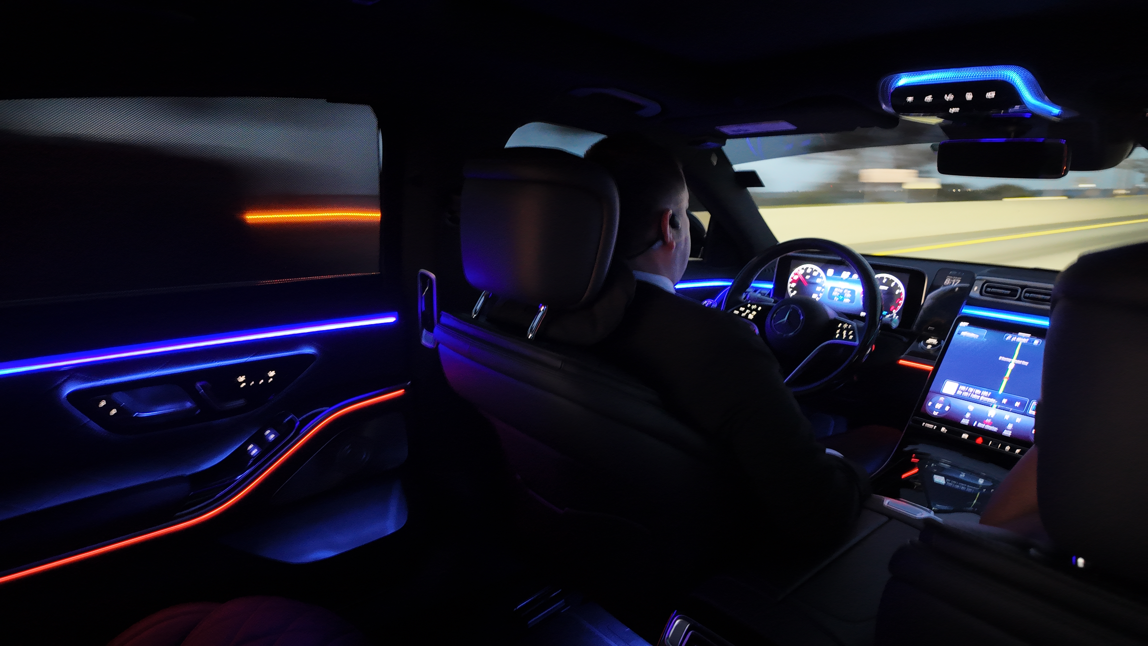 Mercedes-Benz S-Class interior at night with ambient lighting - LuxRide executive mobile office Tampa Bay